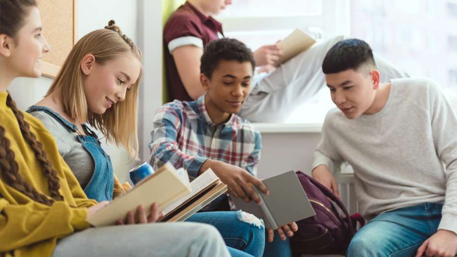 Group of students reading books