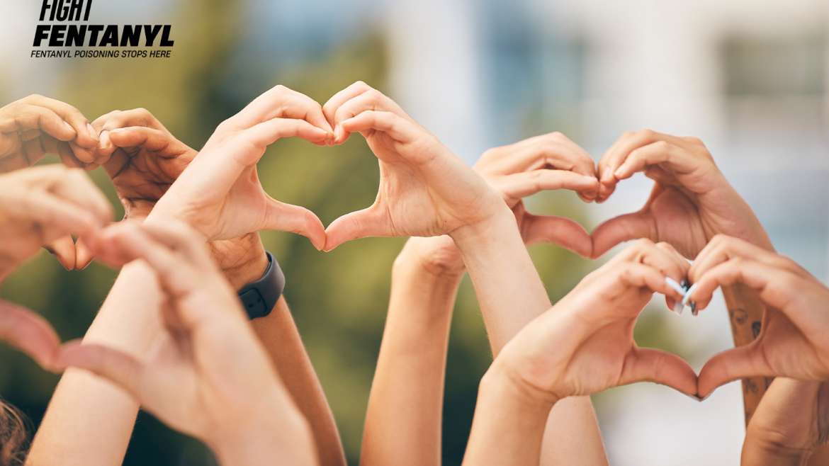 Group of hands making hearts